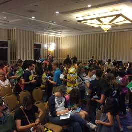 Spellers collecting autographs in their Bee Keepers during orientation.