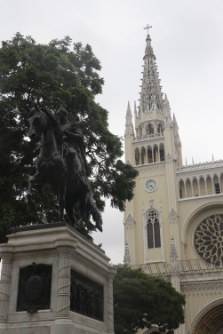 Monument of Simon Bolivar with the beautiful Metropolitan Church of Guayaquil in the background.